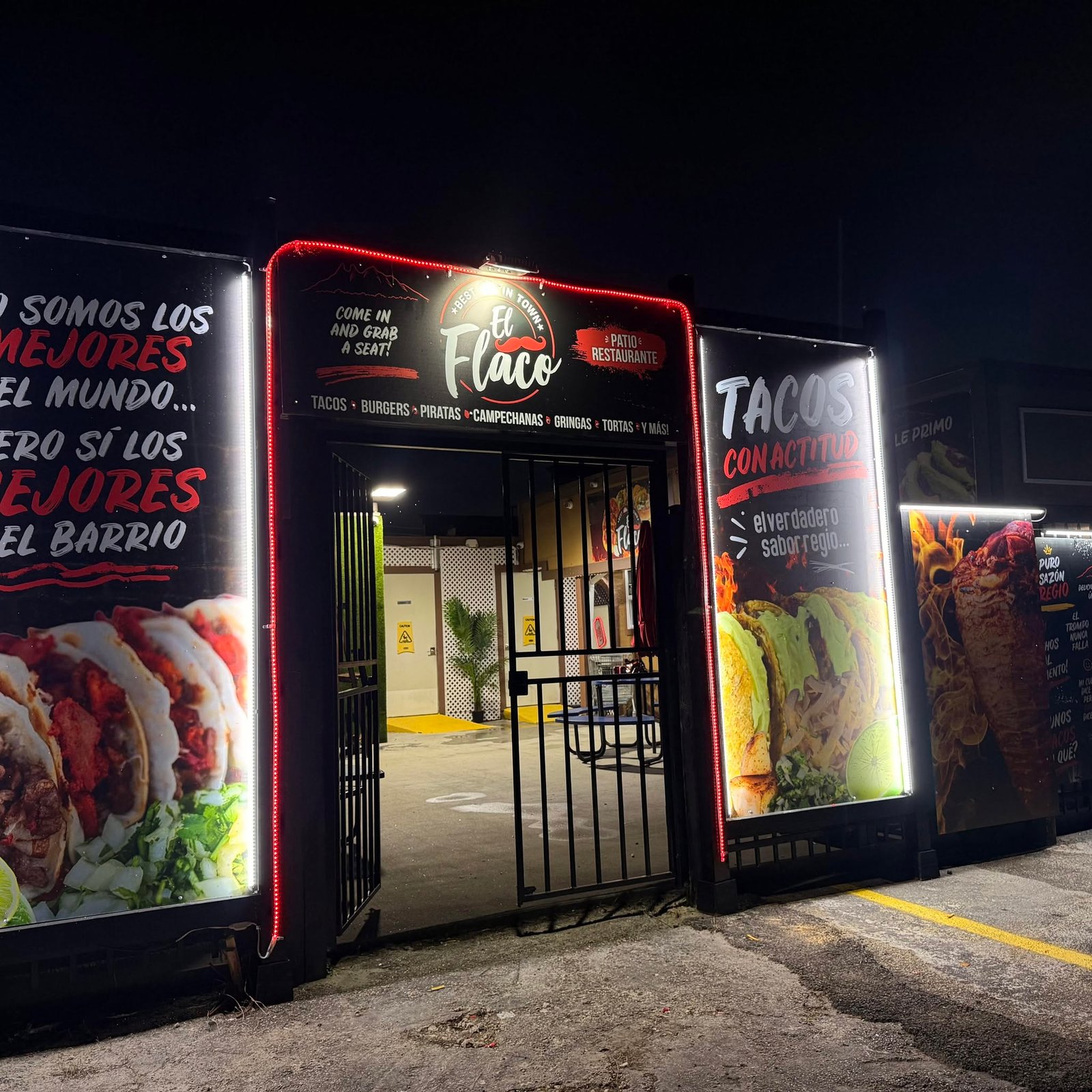 Tacos El Flaco restaurant entrance at night